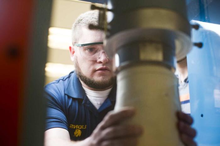 Engineering student working with equipment