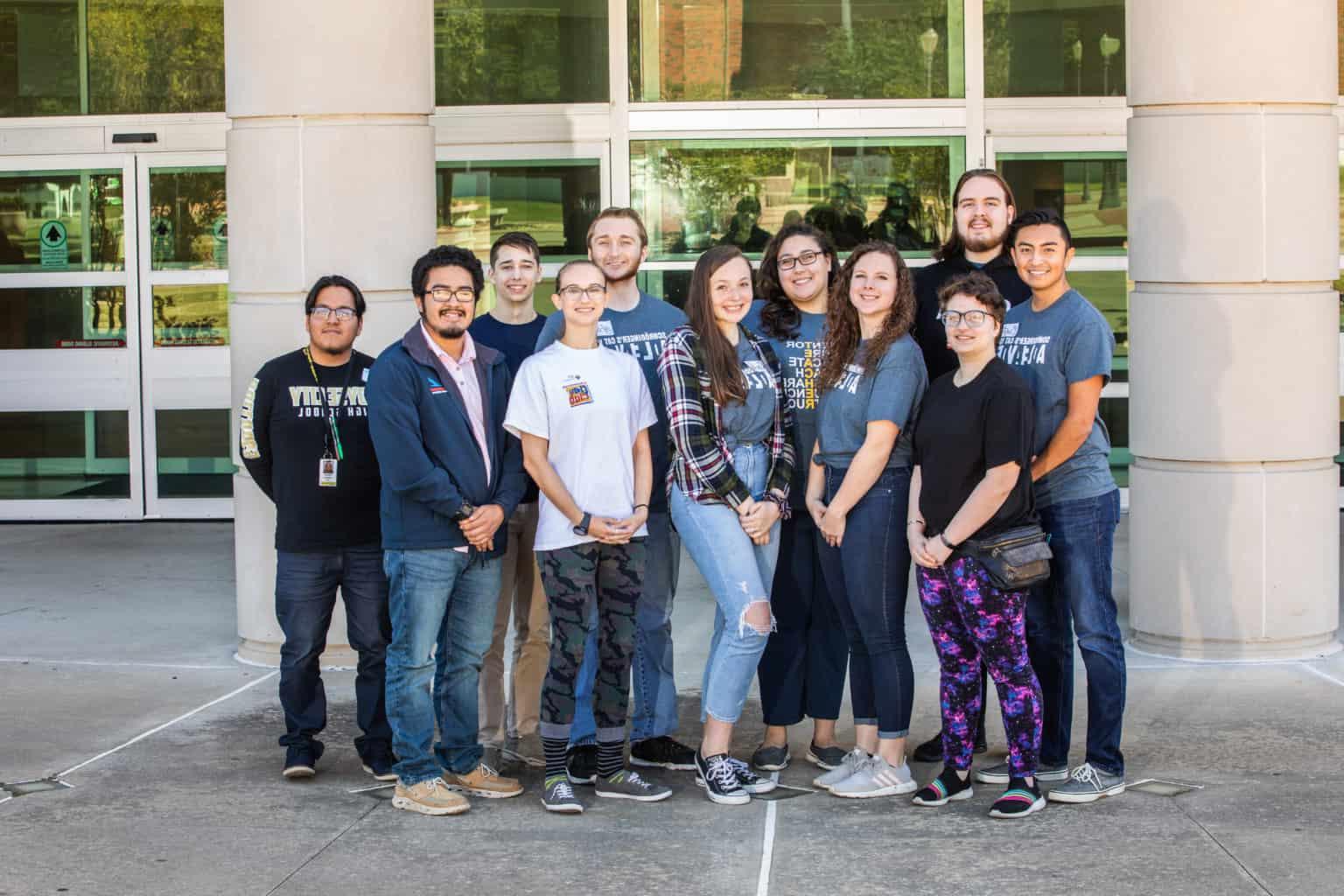 Group standing in front of a building.